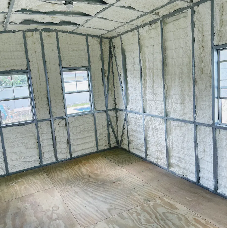 Closed-cell spray foam insulation applied to wall cavities in a residential project in Rochester